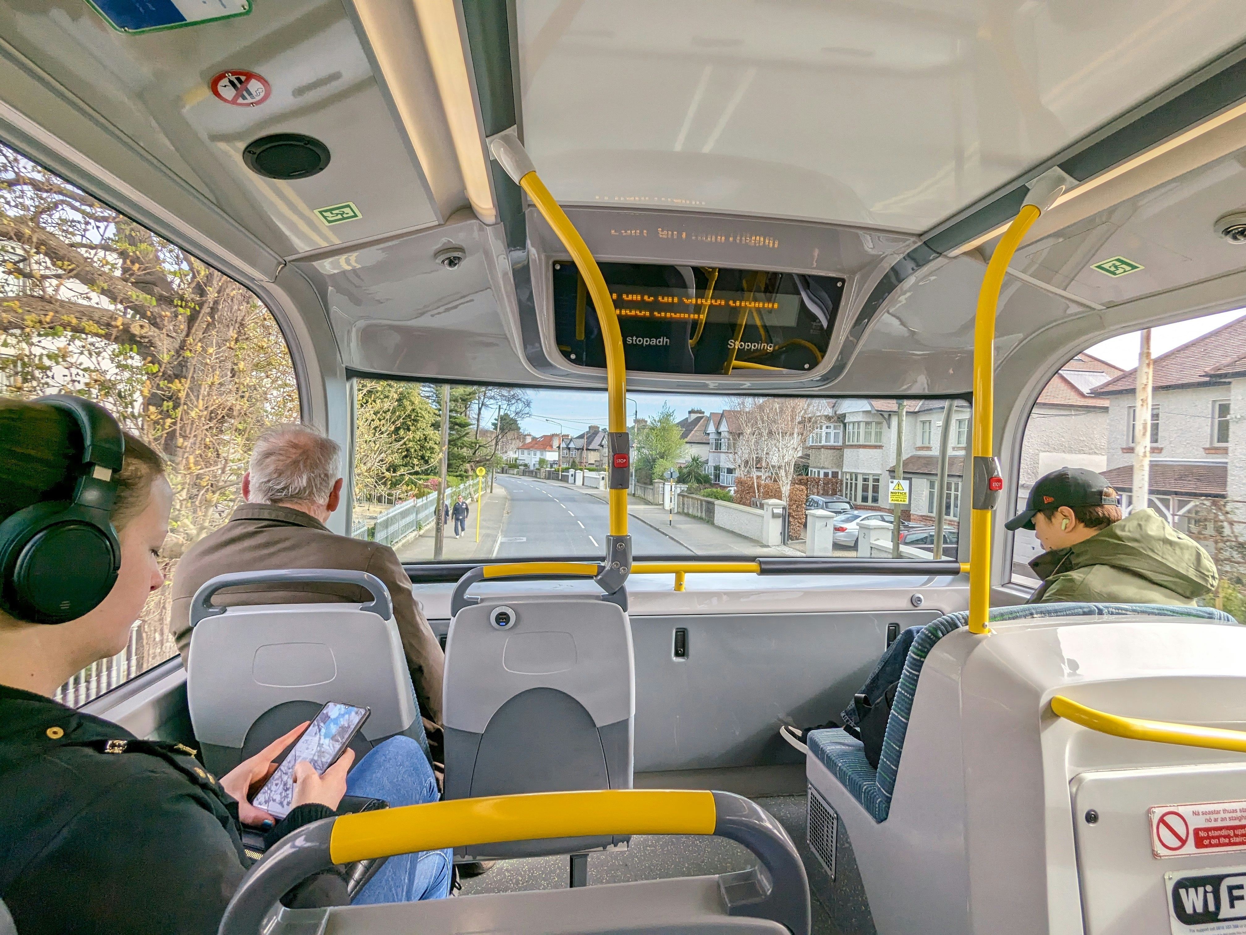 Passengers inside a bus looking out the window